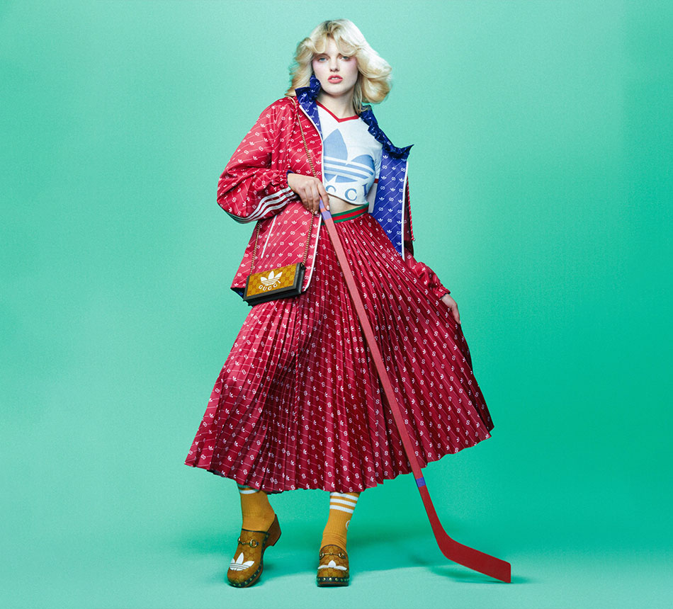 A blond woman is wearing a red skirt and a red jacket. (Photo)