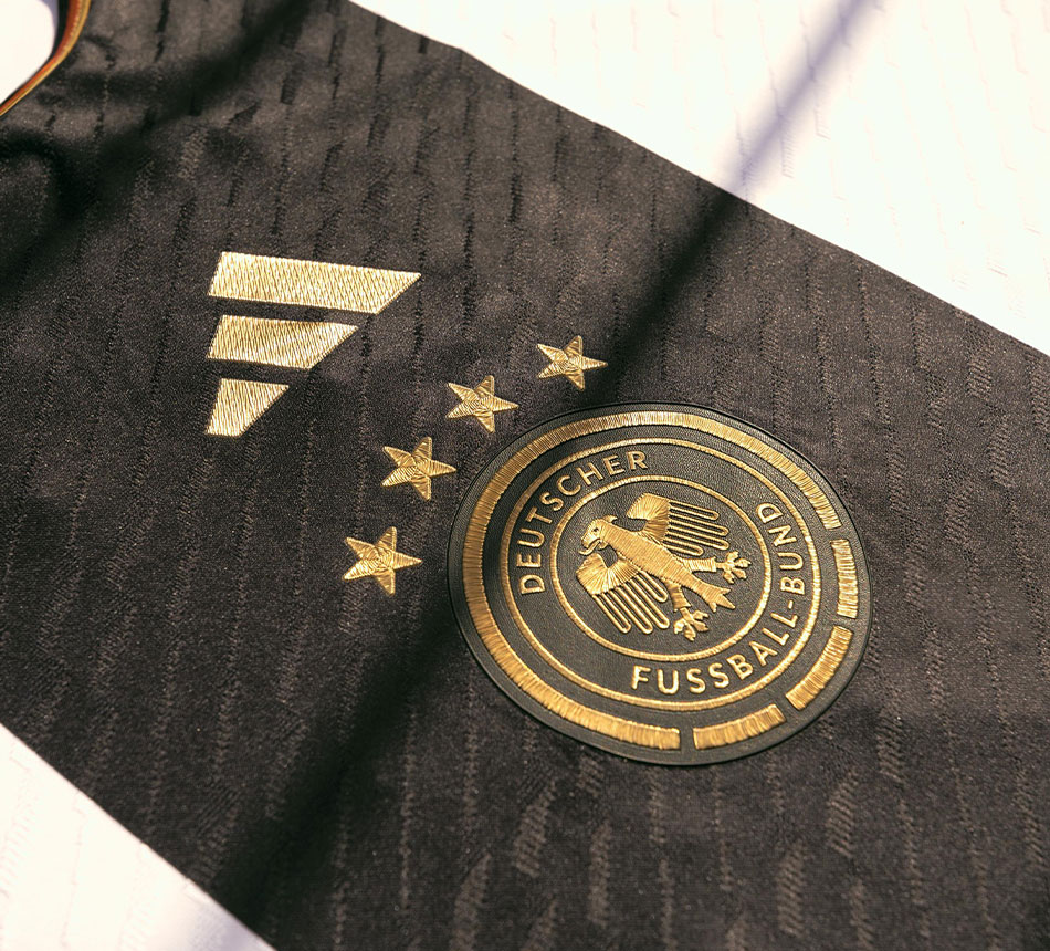 The German World Cup jersey in black and white including the adidas logo in gold (Photo)