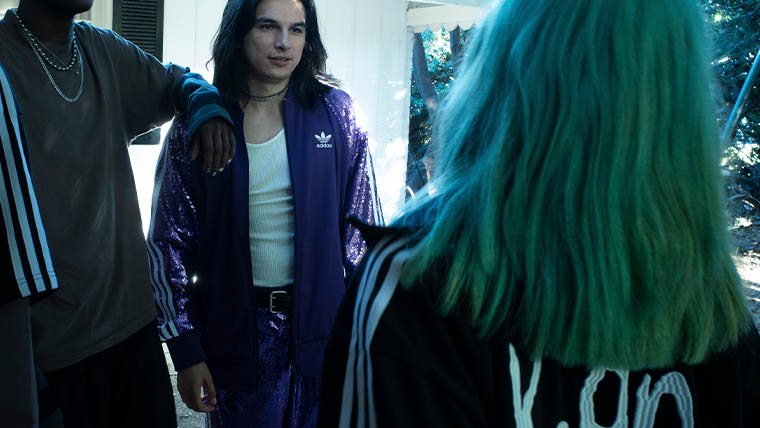 Three people wear adidas x Korn jackets (Photo)