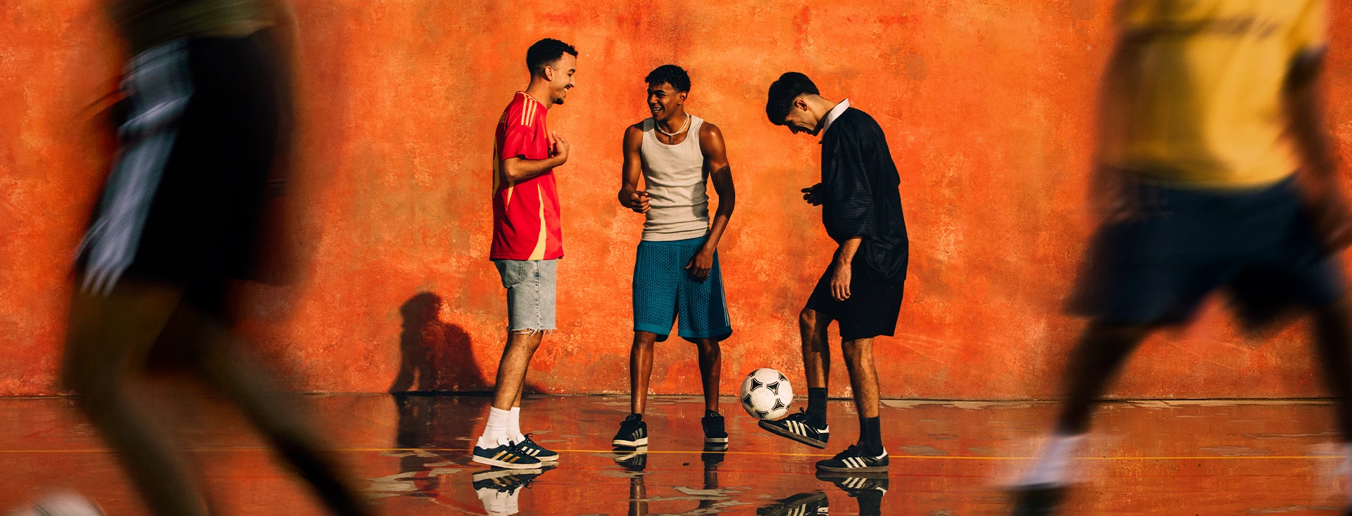 The image shows a group of young athletes who appear to be engaged in discussions or strategizing.