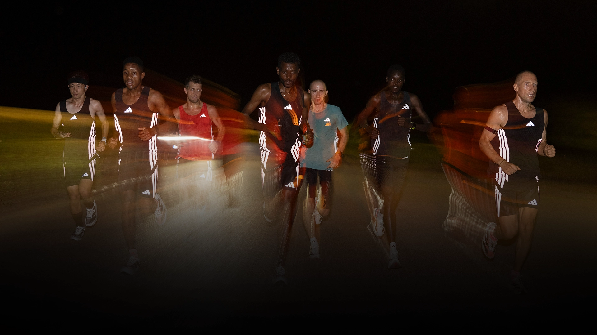 Running group training at night in adidas running apparel. (Photo)